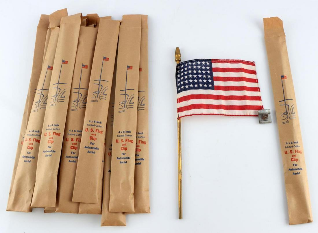 LOT OF 18 48 STAR U.S. HAND HELD FLAG W CAR AERIAL: In original packaging, 4 x 7 inch hand held flags with clip for automobile aerial, pre 1957.