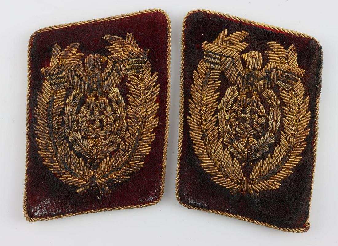 WWII GERMAN THIRD REICH NSDAP LEADER COLLAR TABS: A pair of NSDAP collar tabs. Reichsadler with gold bullion on brown felt. RZM tag on reverse. Measure 2 1/2 inches. Very good condition with age wear. Age indeterminate. Non-fluorescing.