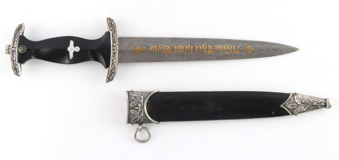 WWII GERMAN THIRD REICH SS HIGH LEADER DAGGER: Third Reich SS high leader honor dagger. Damascus steel blade with gold leaf "Meine Ehre heisst Treue" on obverse Eickhorn maker mark on reverse. Silver toned crossguard and pommel. Wood grip. Housed