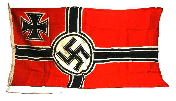 WWII GERMAN KRIEGSMARINE FLAG 54 X 31 INCHES: WWII German Kriegsmarine flag measuring 54 by 31 inches. Kriegsmarine property mark on hoist, and makers tag "G.A. Frohlichs Sohn / A. G. Warnsdorf. Sud.". No holes, minor staining, overall very good 