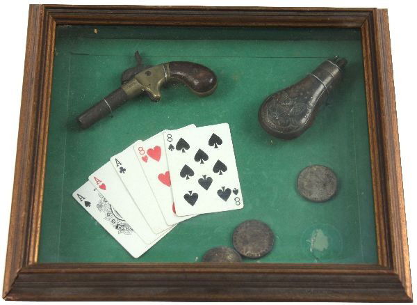 AST CO. PERCUSSION PISTOL FRAMED W MORGAN DOLLARS: A shadow box frame containing a American Standard Tool Co. "Hero " percussion pocket pistol in very good condition, a powder measure, 3 silver Morgan dollars common date coins, and some vintage playin