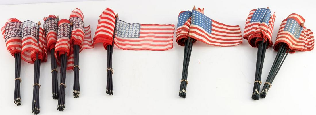108 VINTAGE 48 US STAR FLAGS SILK AND COTTON: 72 silk flags and 36 cotton flags. Very good condition. Sticks measure approximately 11 inches. Flags measure 5 inches.