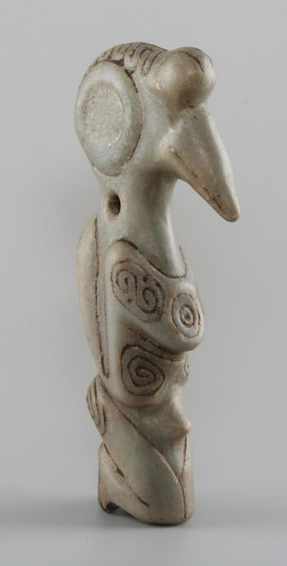 TAINO HUMAN WOODPECKER TRANSITIONAL STATUE: Taino. Human transitioning into woodpecker. The woodpecker was the bird in Taino mythology that opened androgynous beings to male encounter thus creating the female gender. The stylized figure has ind