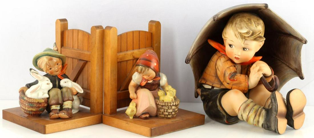 HUMMEL UMBRELLA BOY 152 A AND VINTAGE BOOKENDS: 3 Hummel porcelain figurines: 7 1/2 inch Hummel Umbrella Boy 152 A hallmark dated 1960's in very good condition. Also Bookends featuring Chick Girl and Playmates, unable to see hallmark however style
