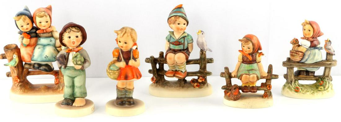 HUMMEL LOT OF SIX SITTING ON FENCE COLLECTORS: Lot of six (6) Hummels. "Coquettes" (#179), TMK 8. "Wayside Harmony" (#111), TMK 4. "Just Resting" (#112 3/0), TMK 4. First Issue "Pay Attention" (#426 3/0), TMK 7. "Lost Stocking" (#374), TMK 5. "Sch