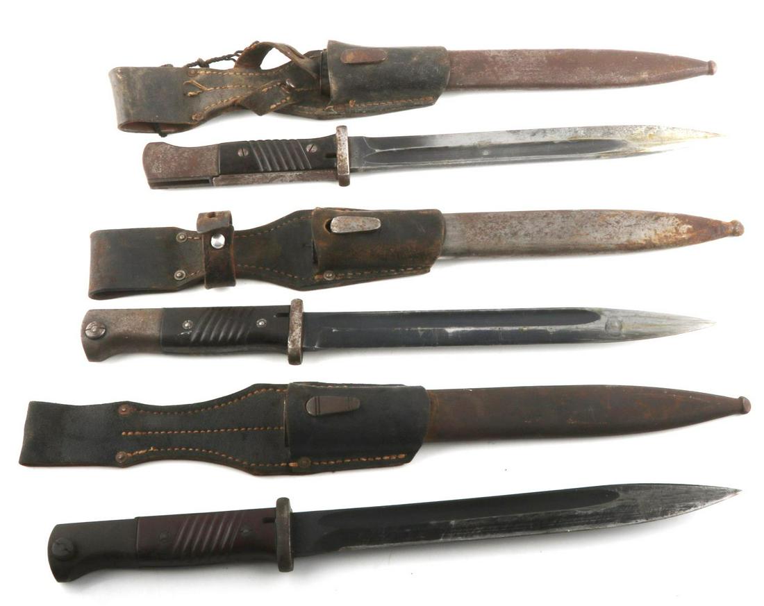 3 WWII GERMAN K98 BAYONET LOT W SCABBARD & FROG: One frog is stamped KVZ 1943, the others are not, no matching serial numbers, all scabbards are dent free, all have Bakelite grips, blades are very good or better.