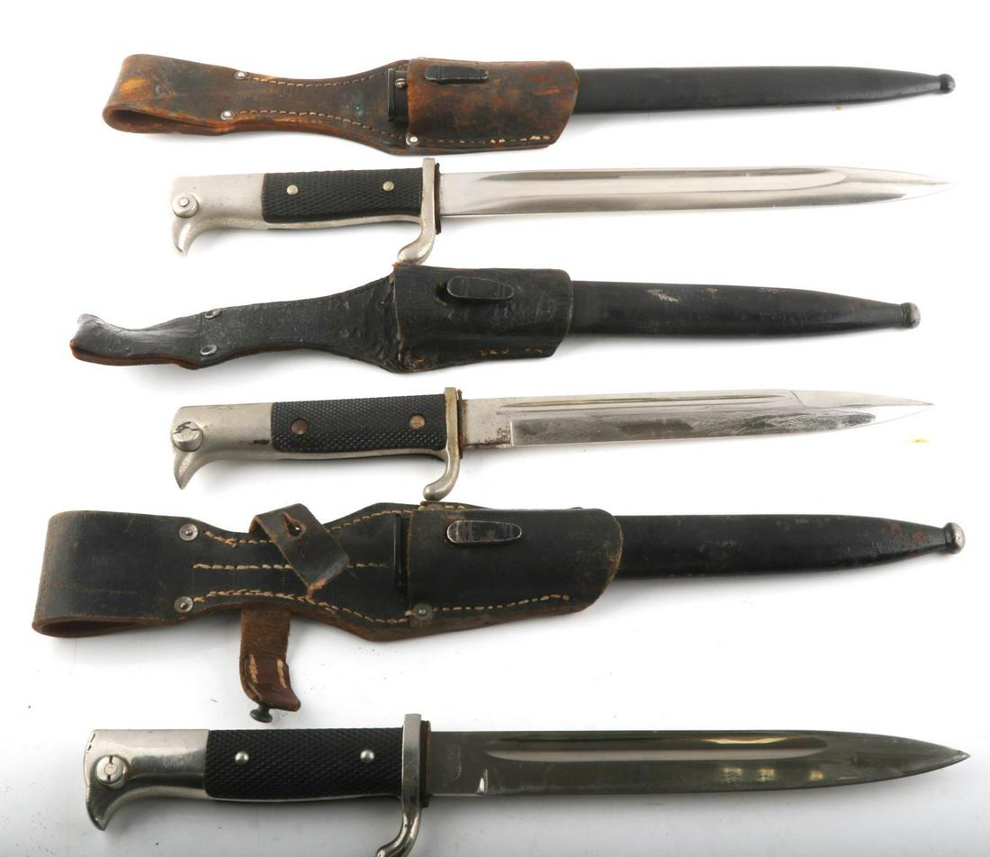 3 WWII GERMAN DRESS K98 WALKING OUT BAYONET LOT: Includes 2 short and 1 long, all very good blades and good scabbards, maker include E Pack & Sohne, the long bayonet is Alcoso, faint date on frog 1940, Fireman dress is Tiger Solingen, all have leath