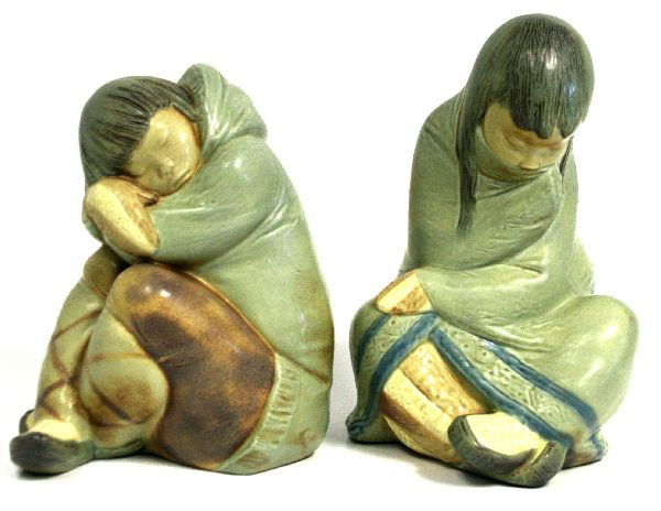 LLADRO PORCELAIN ESKIMO GIRL & BOY FIGURINES: 10.25 inch "Eskimo Nap" #2541 and 8.75 inch "Eskimo Slumber" #2540 in gres finish. Very good condition with no chips, repairs or crazing.