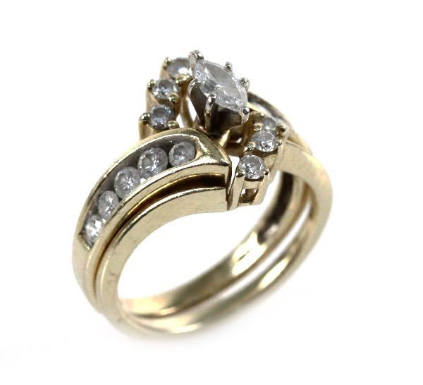 LADIES 14K YELLOW GOLD MARQUISE WEDDING SET 1 CTW: Ladies 14k yellow gold marquise diamond wedding set, size 6.5. Ring features a marquise cut center diamond, approx 0.27 ct with 10 round channel set diamonds, approx 0.06 cts each, along the band. The