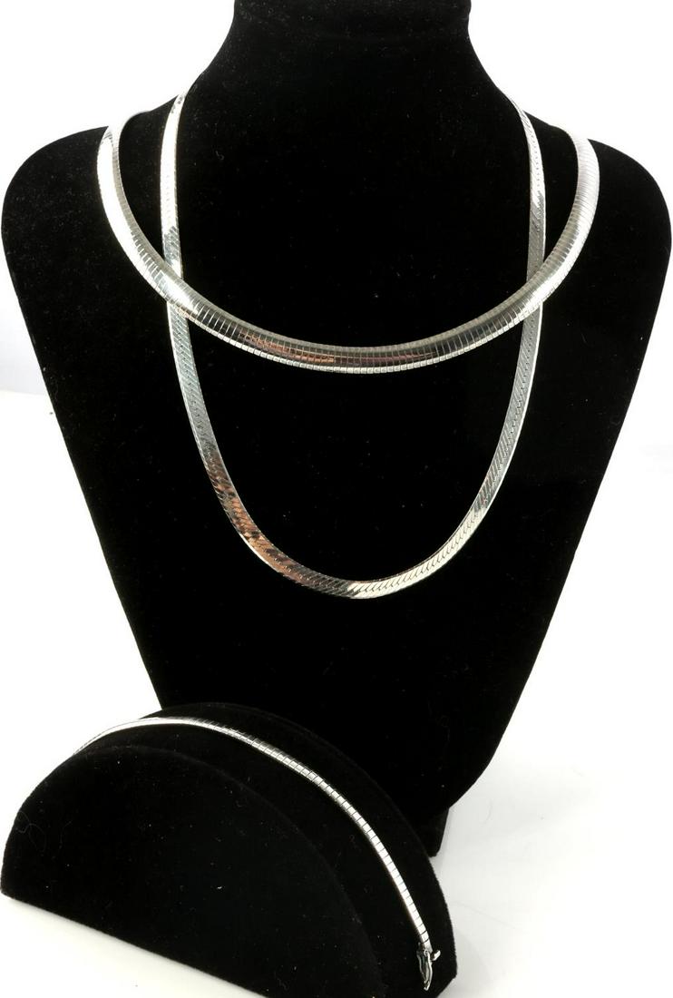 STERLING SILVER 925 NECKLACES & BRACELET 64 GRAMS: Sterling silver necklaces & bracelet. 19 inch herring bone sterling silver necklace with standard clasp. 17 inch omega sterling silver chain with box clasp, features matching 6.75 inch bracelet. All p