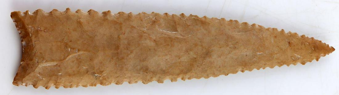 6 INCH SERRATED DALTON NATIVE AMERICAN ARROWHEAD: 6 inches. Nice serrated edge with concave base. Tan flint. Very good condition. Unauthenticated, sold as is.