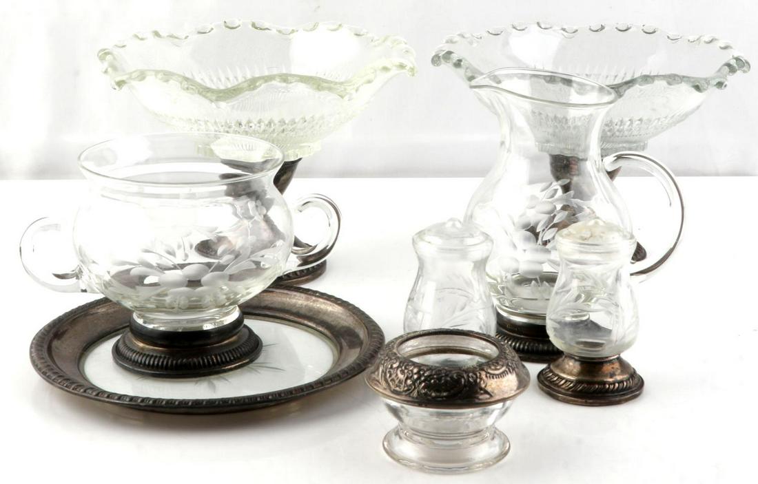 ANTIQUE STERLING SILVER ETCHED GLASS TABLEWARE: Quaker and Dutch sterling silver and glass tableware accessories. Includes salt and pepper shakers, bread plate, creamer and sugar bowl, 2 small 6 inch diameter center piece knob glass fruit bowls, an