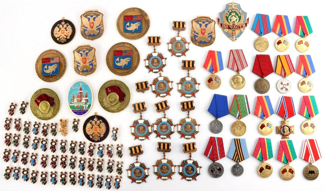 MASSIVE SELECTION OF SOVIET RUSSIAN MEDALS & PINS: Included: 50 Soviet bear pins from 1980 Olympic games in Moscow. Eight Soviet veteran of foreign wars medals from Vietnam and Cuban events. Group of varied ten Russian and Soviet medals. Group of ten 