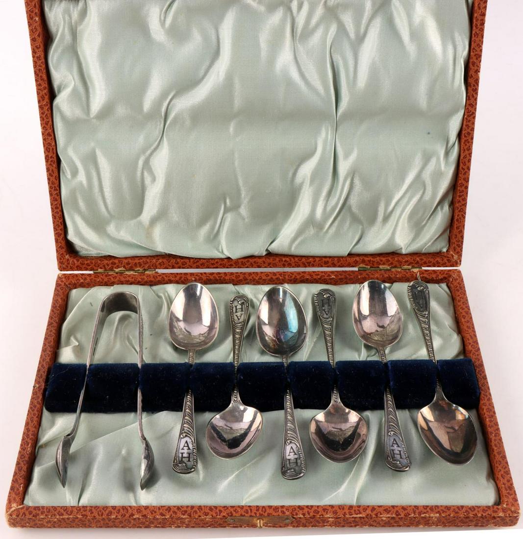 ADOLF HITLER SIX TEA SPOON AND SUGAR TONG SET: Set of 6 silver tea spoons with sugar cube tongs belonging to Adolf Hitler. Each piece is engraved with "AH." "J.D. & S." and "EPN" stamped on back of each handle. All pieces show very minor wear. Com