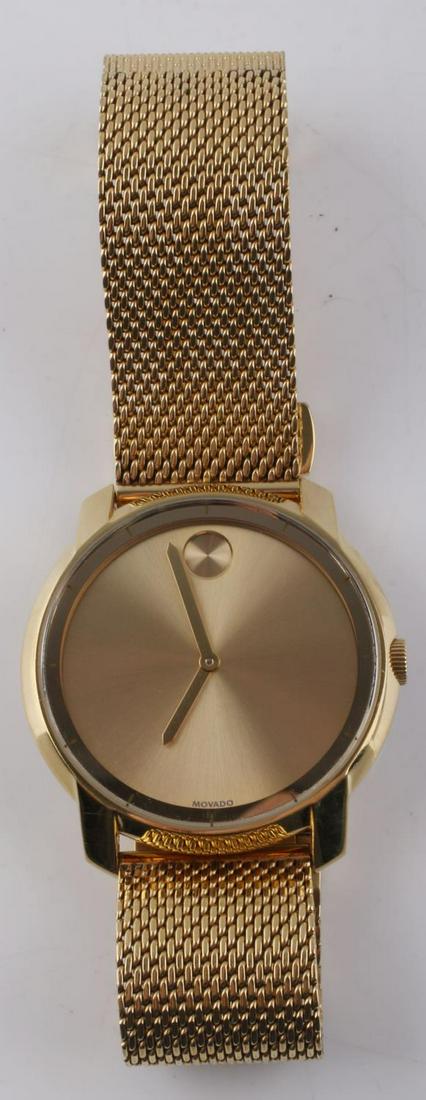 MOVADO BOLD MENS GOLD TONE MESH BRACELET WATCH: From the Movado "Bold" collection. Gold tone stainless steel case with unique mesh bracelet/band. Swiss movement. Water resistant. Champagne/gold dial. Comfortable mesh bracelet snaps closed to approx