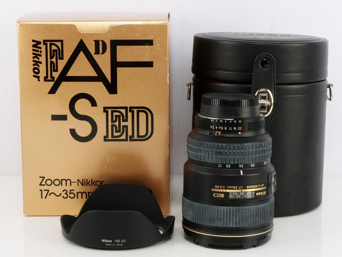 NIKON ED AF-S NIKKOR 17-35MM 1:2.8D LENS W HOOD: Nikon ED AF-S Nikkor 17-35mm 1:2.8D zoom lens with Nikon HB-23 hood and original box with Nikon CL-76 hard case. No scratching to either lens. Light signs of wear with most on the zoom and focus dials