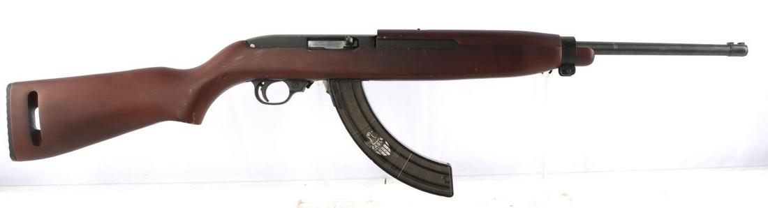 RUGER MODEL 10/22 CARBINE 22LR SEMI AUTO RIFLE: Ruger Model 10/22 .22LR caliber semi-automatic rifle with 30-round magazine. Bright and clear bore. 18 inch barrel marked to left "Ruger Model 10/22 Carbine .22LR Caliber" and serial number. Full wood