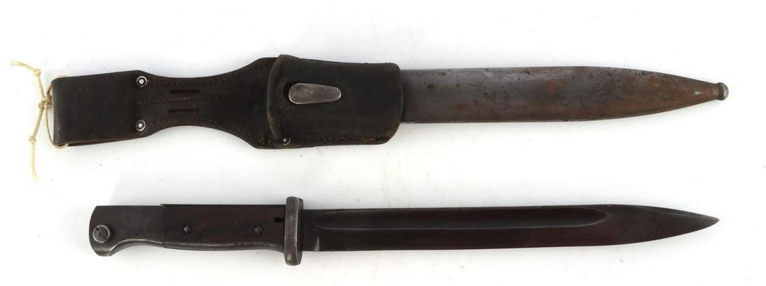 WWII GERMAN THIRD REICH MAUSER BAYONET W NUMBER: Steel blade with wood grip housed in steel scabbard. Serial number on blade is 0424 and scabbard is 0327. Measures 16 inches. Very good condition.