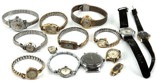 DEALERS LOT OF VINTAGE WATCH MOVEMENTS & PARTS: Mixed dealers lot of vintage watch movements, parts, and cases. Brands include Timex, Bulova, Lucerne, Universal, Sheffield, Baylor, Acqua, and Waltham. Many watches with gold filled cases.