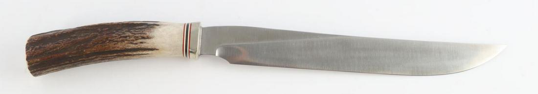 VINTAGE RANDALL CARVING KNIFE WITH STAG HANDLE: Stamp and handle spacers date this Randal carving knife between 1967 and 1977. In very good condition with a 9 inch blade, 5 spaces, and a 4 1/2 inch stag handle. No sheath provided.