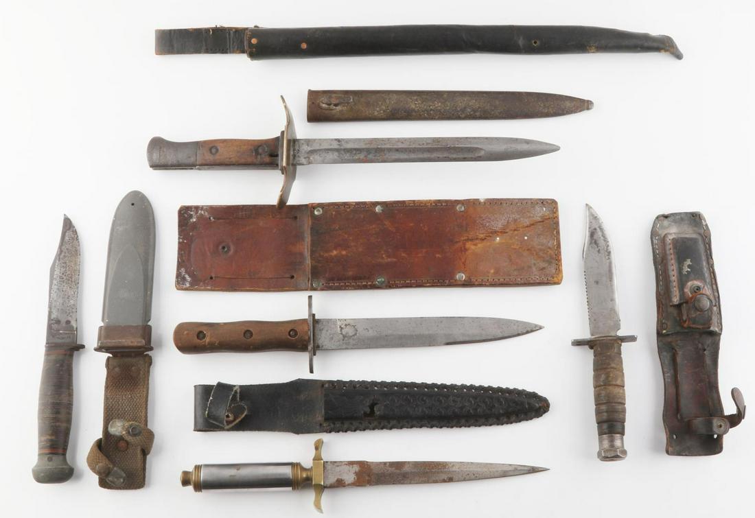 5 WWI WWII FIGHTING KNIFE LOT GERMAN U.S.: In addition to the 5 knives, this lot includes a 16 inch leather fighting knife sheath, German Bayonet with scabbard altered cross guard, PAL USN Mark I knife in Mark I sheath, fighting knife with chr