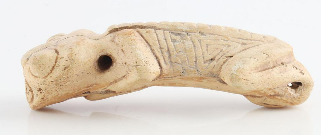 TAINO ZOOMORPHIC PENDANT LIZARD FORM: Nicely carved human to zoomorphic pendant. Large mouth depicting teeth and bulging eye gives this piece a distinct personality. Arms and legs turn under to rest on base. Manatee bone. Length 3.5 inche