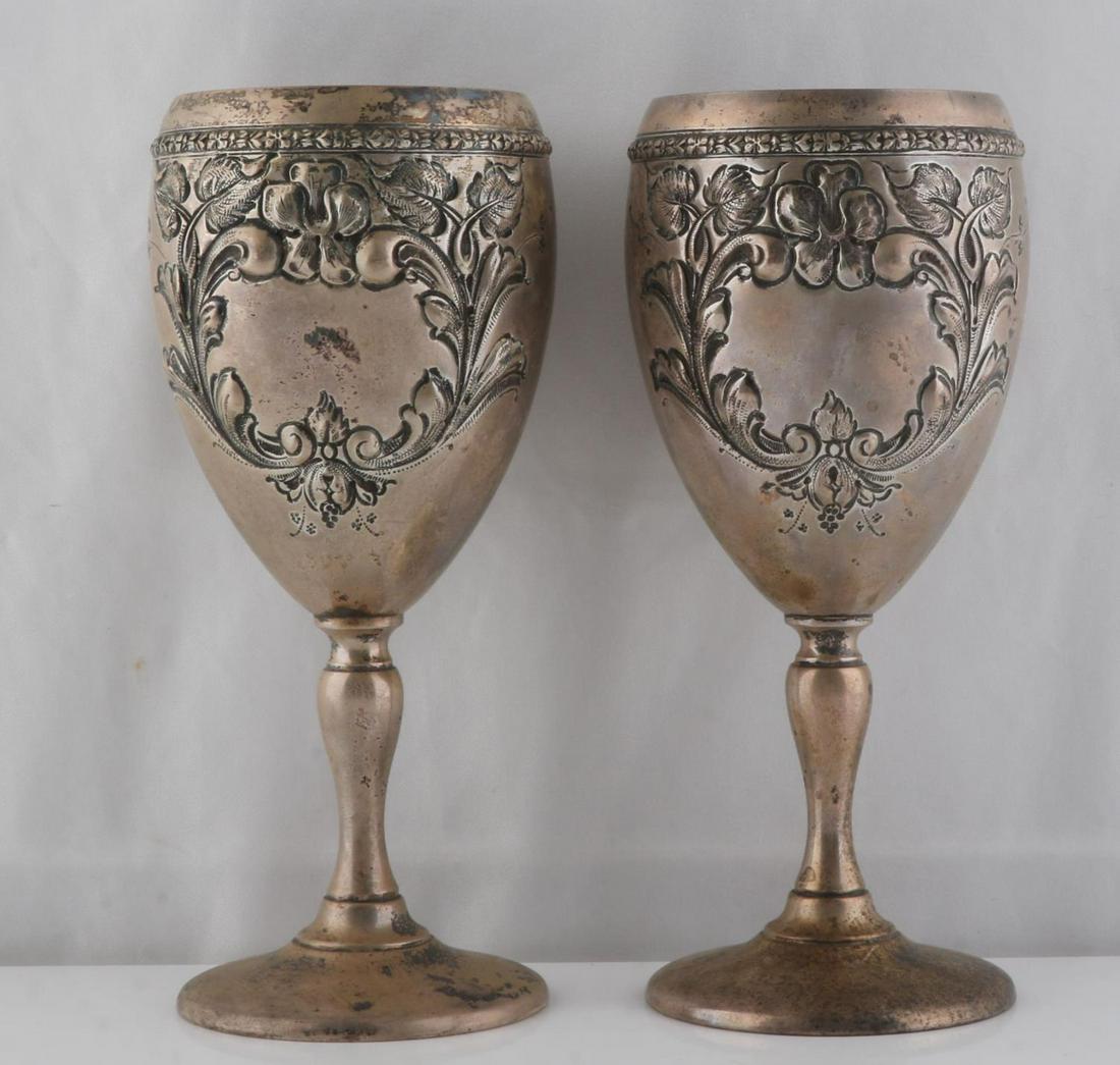 2 FISHER VIOLET STERLING SILVER WATER GOBLET: 2 Fisher sterling silver 7 inch water goblets, Violet pattern, each with hand chased floral decorations. Marked Sterling and Hand Chased to underside of bases. Not monogrammed, tarnished. Total weight