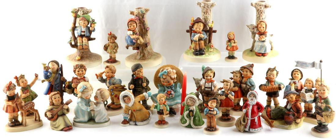 28 GOEBEL GERMANY HUMMEL PORCELAIN FIGURINES: 28 Goebel West Germany Hummel porcelain figures. Majority are signed. Two sets of candle stick holders are included. Many are exclusive member only or limited editions. Majority are vintage. All are i