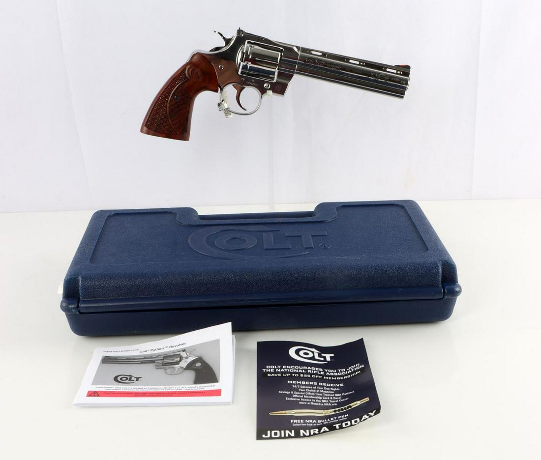 COLT PYTHON .357 MAGNUM 6 INCH BARREL REVOLVER: Stainless steel semi-bright finish. Interchangeable red front sight on black ramp. Fully adjustable black U-notch target sight. Walnut grips. Safety transfer bar. Reversed bullet flutings. Original ca