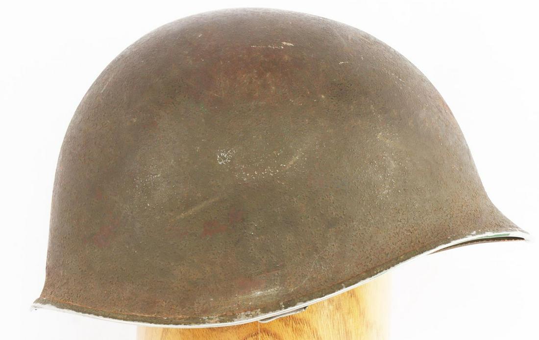 WWII FIXED BALE M1 HELMET & LINER: Heat stamp in front, 36D 2, front seam, hand wri8tten in white 1063, MSA maker stamped liner, named to James, has1 inch split at rear.