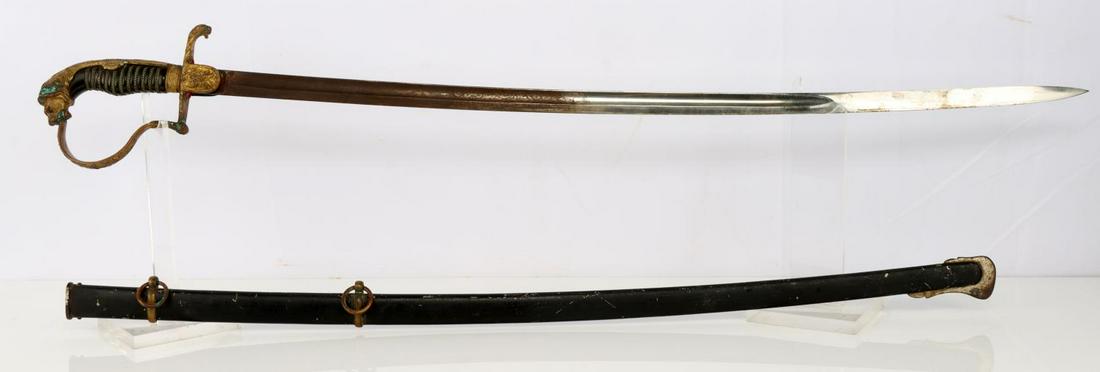 WWI IMPERIAL PRUSSIAN LION HEAD SWORD: Ruby eyes, etched blade, light surface rust and rough to the touch edge, good wire grip and guard, verdigris on guard, easily removed, overall measures 38 inches. Good dent free scabbard.