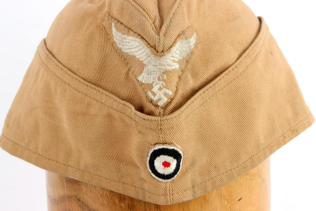 WWII GERMAN REICH AFRIKA KORPS LUFTWAFFE SIDE CAP: Luftwaffe Reichsadler and cockade patches. Otto Graf Wehrmachteffekten Wien 107 mark. Size 58. Very good condition. Fluoresces on patches.
