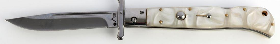 13 INCH AKC ITALIAN SWITCHBLADE KNIFE W SHEATH: Steel blade with AKC mark. White pearl handle. In very good condition.