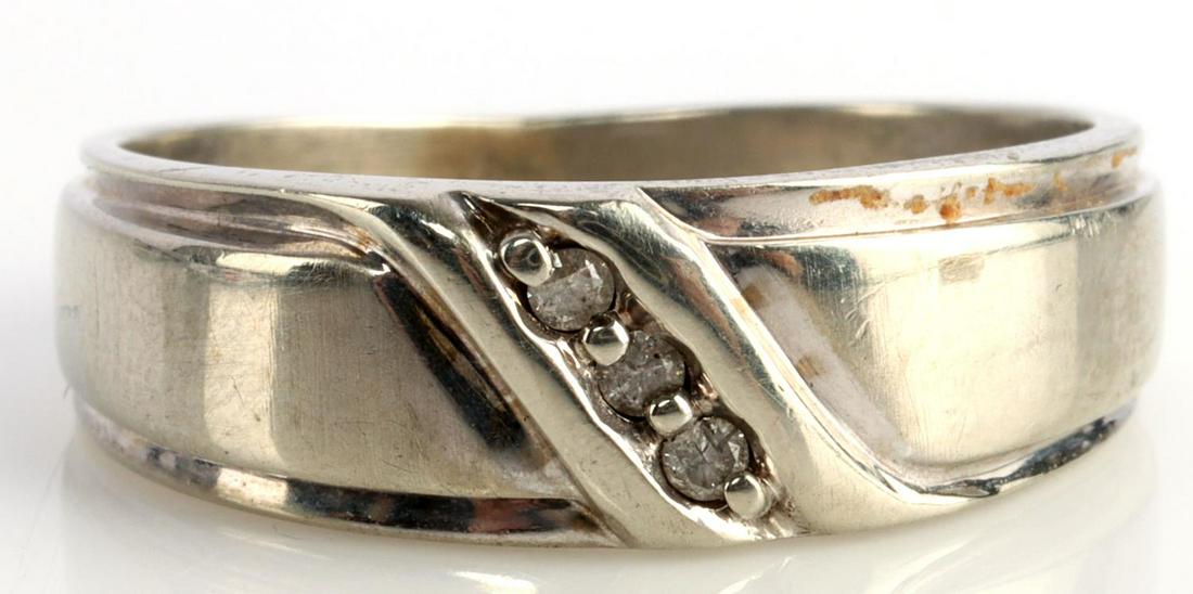 10K WHITE GOLD MENS DIAMOND WEDDING BAND RING: Ring is stamped "10K" inside shank. Round cut diamonds measure 1.58 millimeters. Widest part of shank measures 6.97 millimeters. Ring is a size 10.25. Diamonds are eye clean. Total weight of 4.5 grams