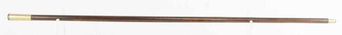 ANTIQUE BULLET TRENCH ART SWORD CANE WALKING STICK: Cane features a very nice quarterfoil blade and a good brass ferrule tip. With bullet grip, cane measures 25 inches and has an overall length of 35 3/4 inches.
