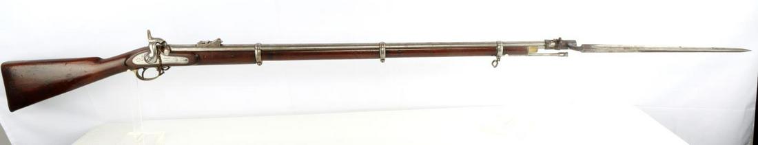 ENGLISH TOWER PERCUSSION RIFLE MUSKET & BAYONET: Marked "Tower 1863" on lockplate with a crown mark. Barrel measures 39 inches long and features a bright and clear bore with distinct rifling. Hammer functions at half and full cock. Adjustable rear l