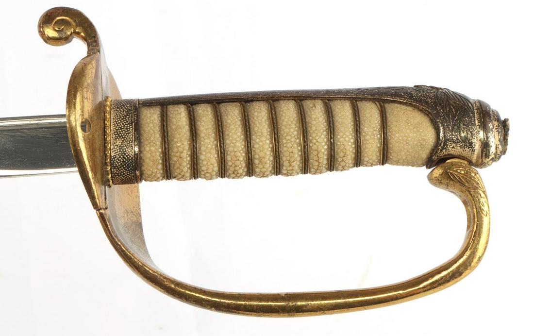 JAPANESE SWORD AND SCABBARD RUSSO NIPPON WAR: Late 19th or early 20th century sword and leather and brass scabbard, decorated with Mumm fittings. Blade is in very good original condition. Full ray and wire grip. Overall length, in scabbard, measu