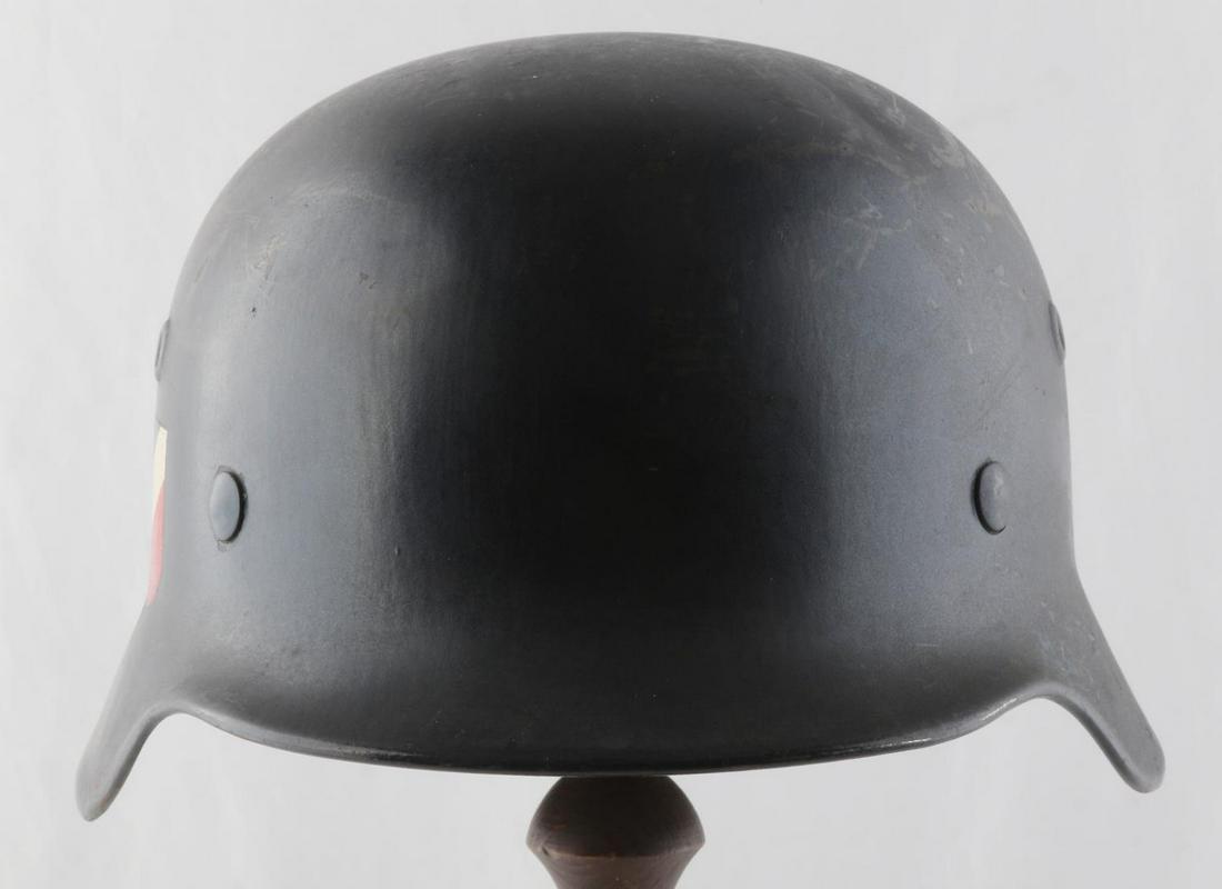 WWII GERMAN THIRD REICH LUFTWAFFE AIR RAID HELMET: Rear heat stamp appears to be K802, left ear ET66, named to Kuhn, good 8 finger liner, no chinstrap, Model M 40, national colors, but shadow of Luftwaffe eagle, very good original condition.