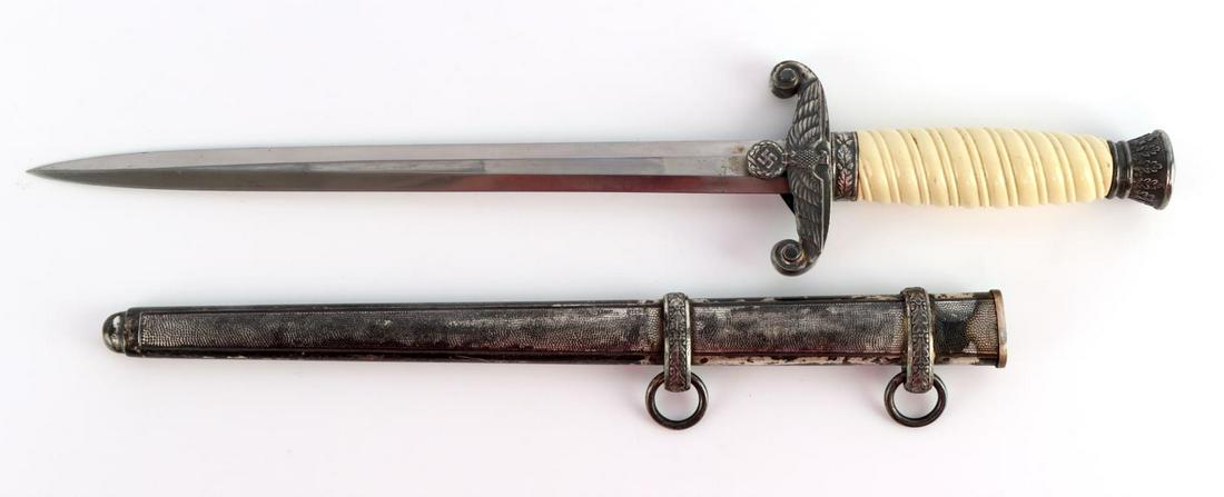 WWII GERMAN HEER HOLLER DAGGER WITH SCABBARD: WWII German Heer dagger with scabbard. Off white celluloid grip with mold line. Appears to have been replaced. Nickel crossguard, ferrule, and pommel. Bright clean blade with FW Holler Solingen etched
