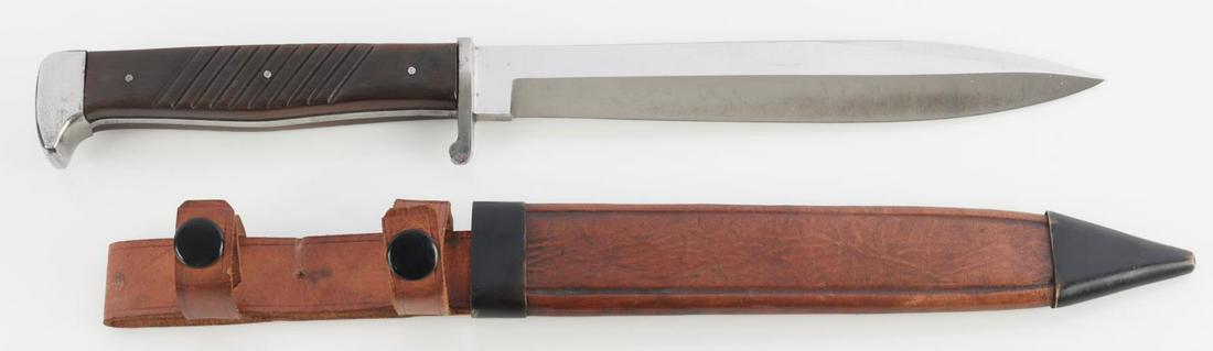 WWII GERMAN REICH HENCKELS FIGHTING KNIFE: Steel blade with J. A.Henckels maker mark. Bakelite grip, steel finger guard, and steel pommel. Measures 13 inches. Very good condition.