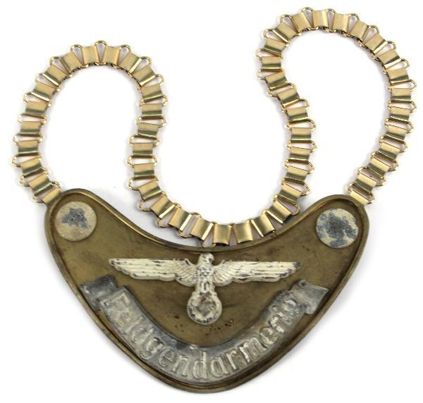 WWII GERMAN FELDGENDARMERIE GORGET LUMINESCENT: WWII German Feldgendarmarie Field Police gorget with chain. Remnants of luminescent paint on front, felt lining on back. Marked CE Juncker, Berlin on back clip. Overall good condition.