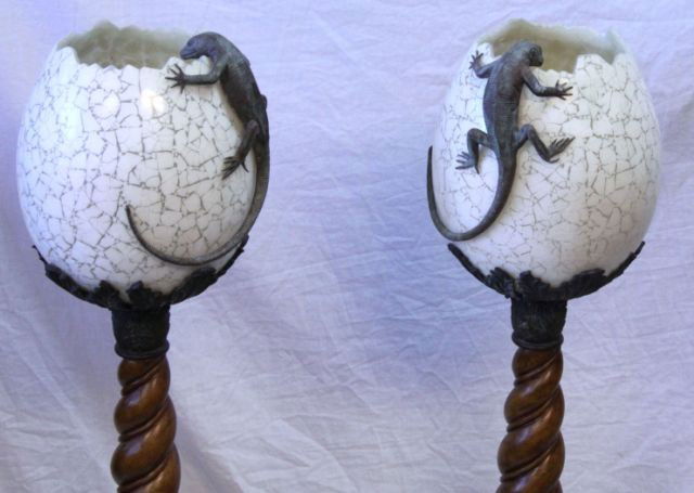 PAIR OF MAITLAND-SMITH IGUANA LAMPS: Pair of Maitland-Smith lamps featuring iguanas looking into cracked eggs. Lamps measure 37 inches tall.