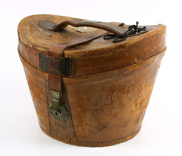 WILD WEST SHOW NATE SALSBURY PERSONAL HAT BOX: Leather hat case belonging to western entertainer Nate Salsbury. Salsbury was known for being the general manager of Buffalo Bill's Wild West Show from 1883 until his death in 1902. Leather on exterio