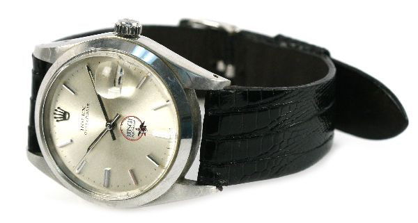 MEN'S ROLEX OYSTER DATE BUSCH BAVARIAN BEER WATCH: Men's Oyster date watch, with black leather band. 29mm face features date function and logo for Busch Bavarian Beer. Weight: 45.4 g Condition: Movement is in working order, some scratching on crystal,