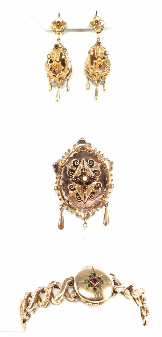 ANTIQUE BOHEMIAN GARNET & GOLD FILL JEWELRY PARURE: Lot includes expandable locket bracelet, 2 inch pendant brooch with seed pearls and garnets and 2 inch clip on tear drop earrings with seed pearls and garnets. All early 20th century, "Antique Bohemia