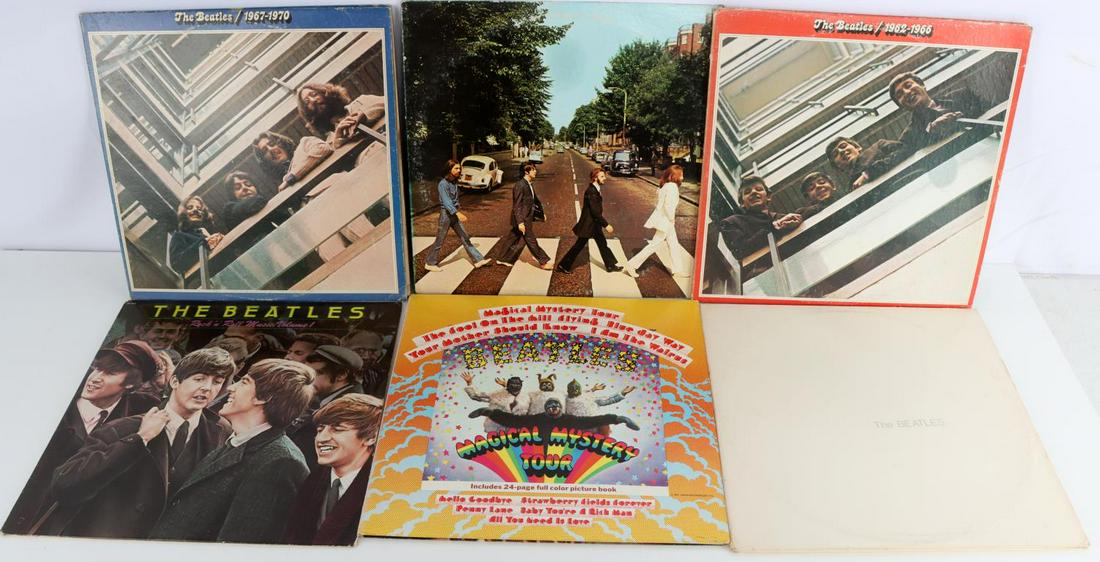6 VINTAGE BEATLES VINYL RECORDS: Vinyls are in mint condition. The covers are in fair to good condition. Albums include: The White Album, The Magical Mystery Tour, Rock n Roll Music Volume 1, 4 record set 1962-1970, Abbey Road.