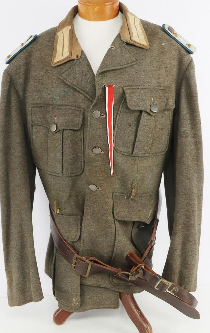WWII GERMAN REICH HEER OFFICER UNIFORM MOVIE PROP: WWII German Reich Heer officer movie prop tunic & leather belt. In good overall condition. light mothing causing one small hole in interior. Leather belt in very good condition. Marked "40" on interio
