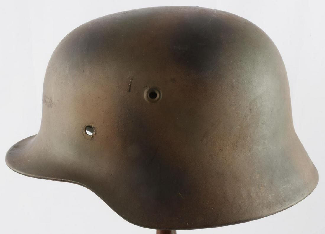 WWII GERMAN THIRD REICH M40 HELMET SHELL: Genuine helmet missing rivets, rear inside stamped 939, left ear ET64, paint age appears post war.