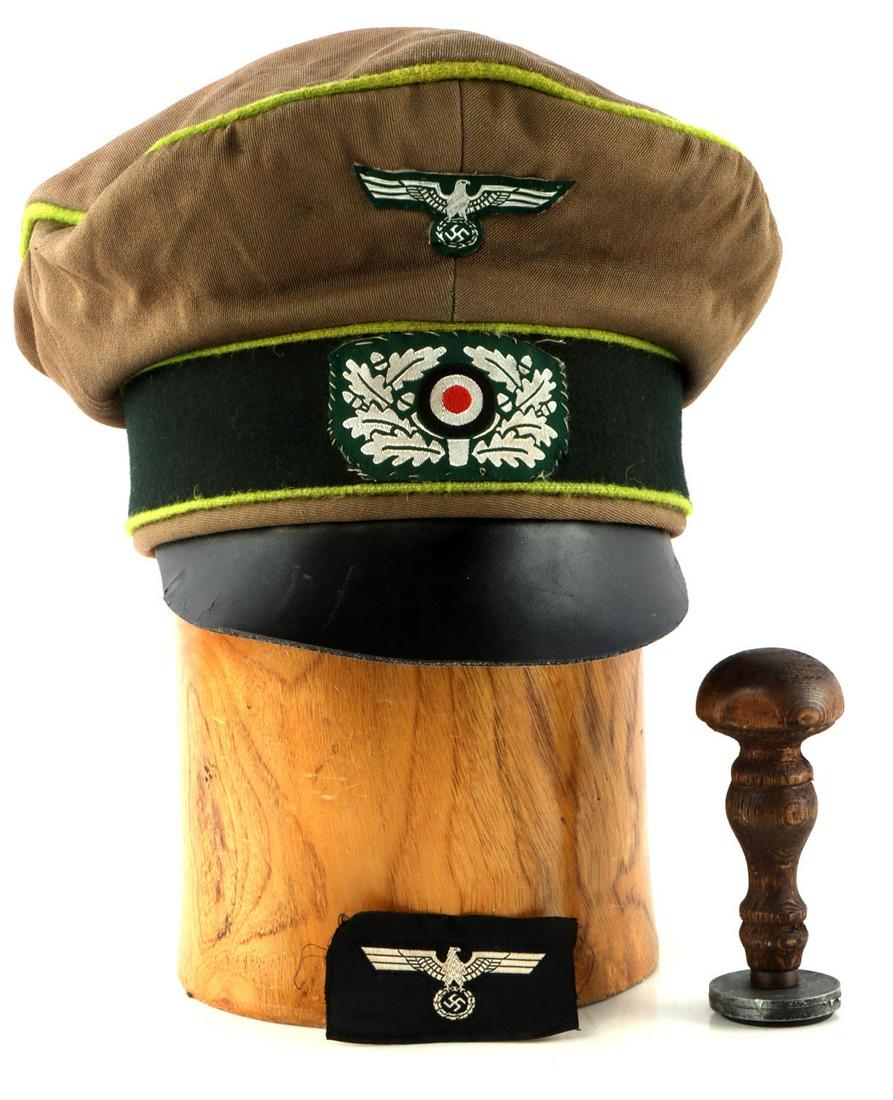 WWII GERMAN REICH PANZER VISOR & SHELLAC STAMP: Eagle side cap cockade, does not fluoresce, Wehrmacht Shellac stamp, 4 1/2 inches, and officers crusher, large wearable 7 1/4, post war reinactor piece. This lot has a reserve.