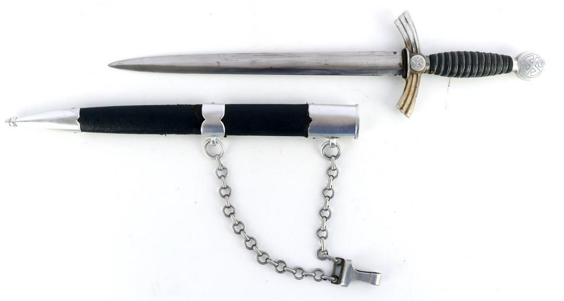 WWII GERMAN LUFTWAFFE 1ST MODEL DAGGER W SCABBARD: WWII German Luftwaffe 1st Model dagger with scabbard. Blue leather grip with silver ware wrapped. Aluminum pommel and crossguard featuring the sunwheel swastikas. Blade show friction marks from scabba